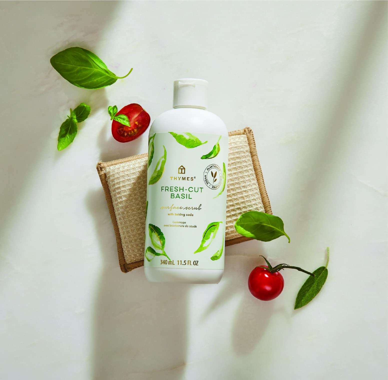 Thymes Soft Surface Scrub bottle label highlights baking soda for stain removal.
