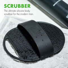 Tiege Hanley scrubber with ergonomic handle for comfortable exfoliation.