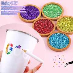 TINKRSTUFF pickup pen assists precise gem placement on surfaces.
