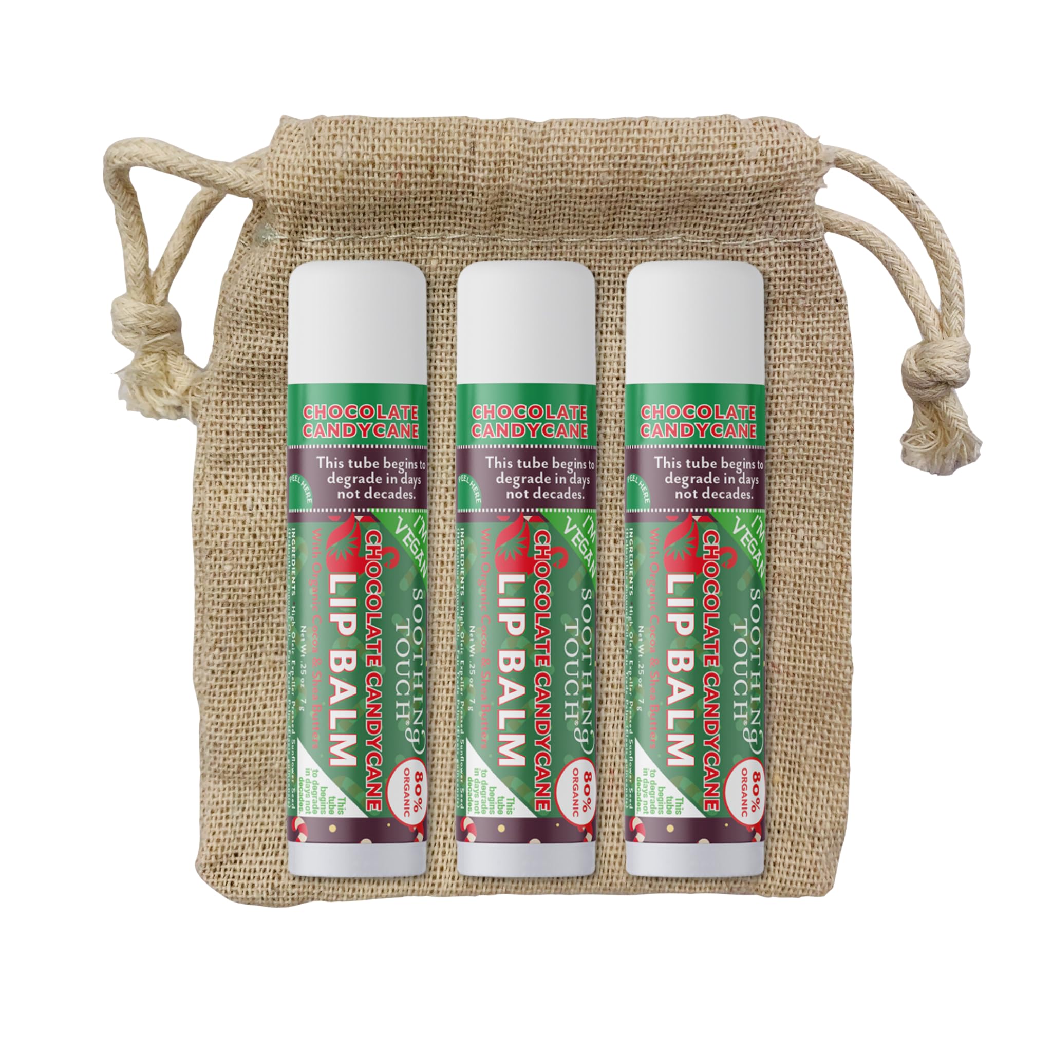 Tiny Seed lip balm tubes against a winter backdrop for holidays