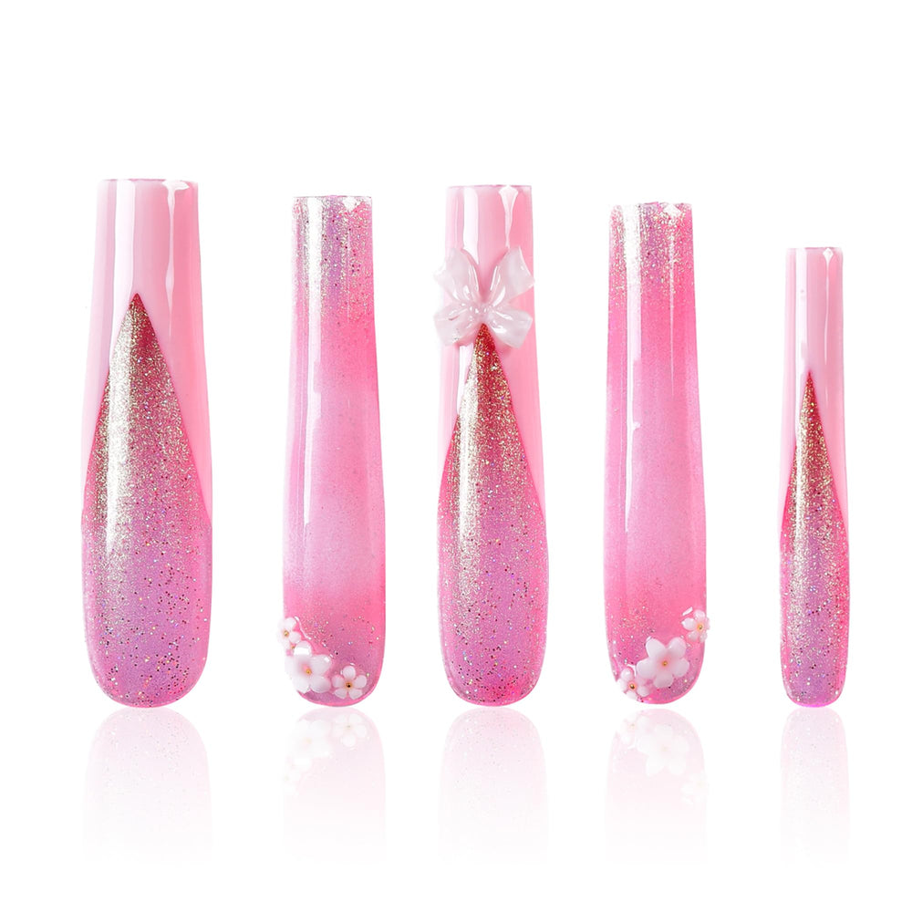 Tmani extra-long ballet-square nails with crystal glitter for a party-ready look.