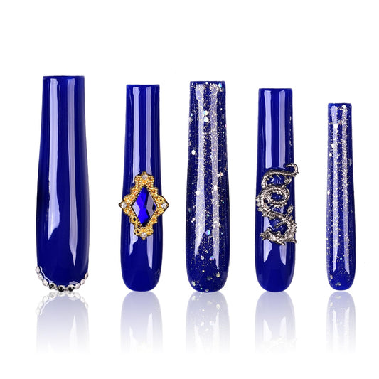 Tmani extra-long press-on nails with crystal glitter for dramatic party looks.