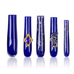 Tmani extra-long press-on nails with crystal glitter for dramatic party looks.
