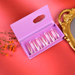 Tmani handmade nails with crystal decorations for a luxe finish.