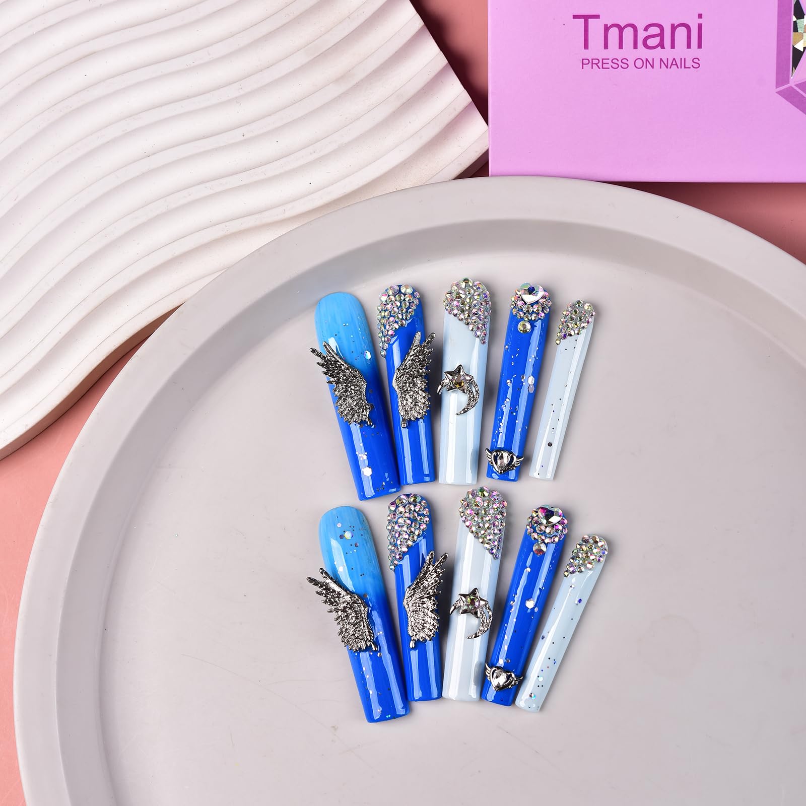 Tmani handmade square nails show salon-quality craftsmanship at home.