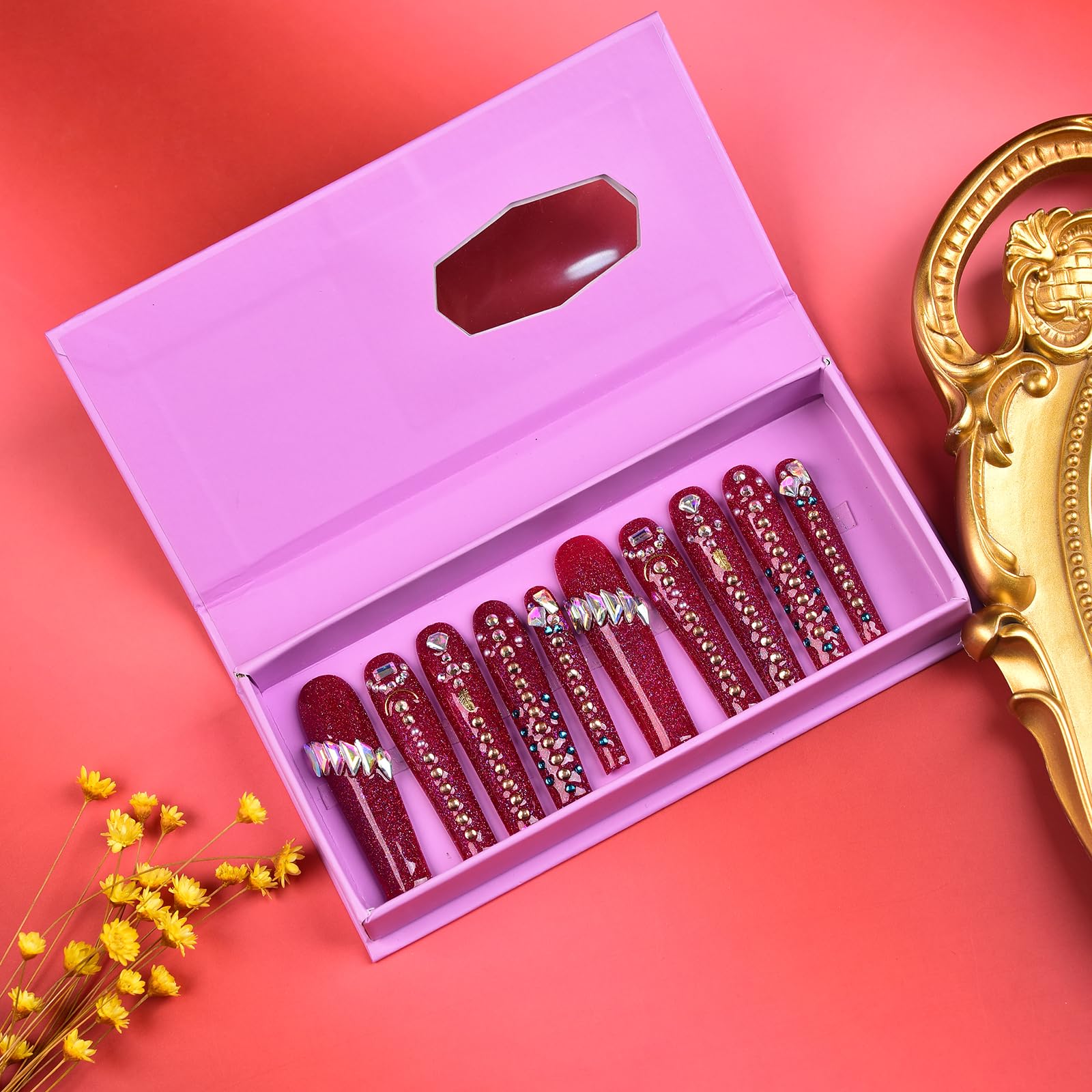 Tmani long square nails with diamond glitter to elevate party outfits.