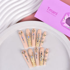 Tmani nails with crystal glitter detail for glamorous party looks.