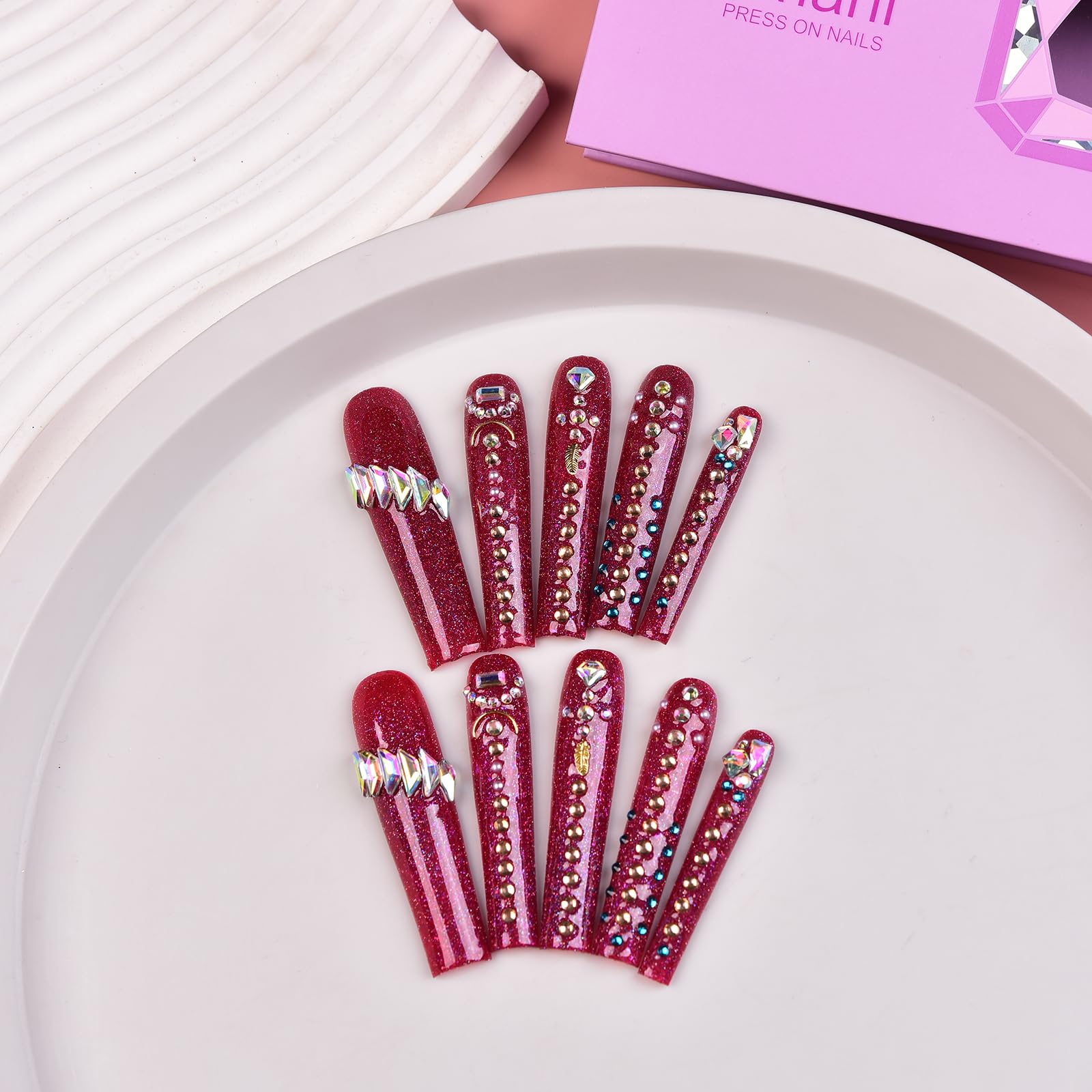 Tmani purple storage case showcases organized press-on nail kit.