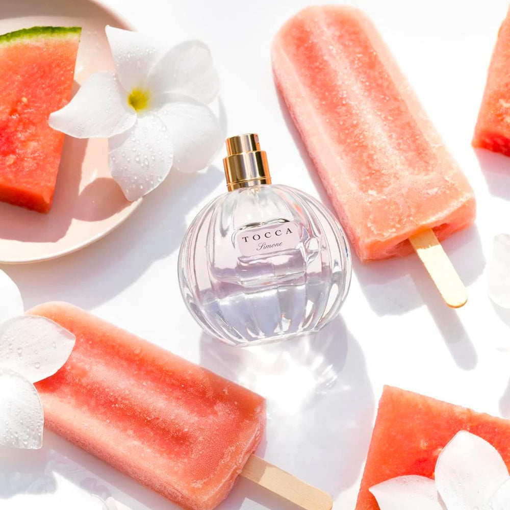 Tocca Simone bottle glows in soft light for radiant moments.
