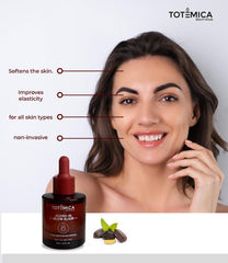 TOTEMICA Glow Elixir dropper releasing oil for quick absorption.