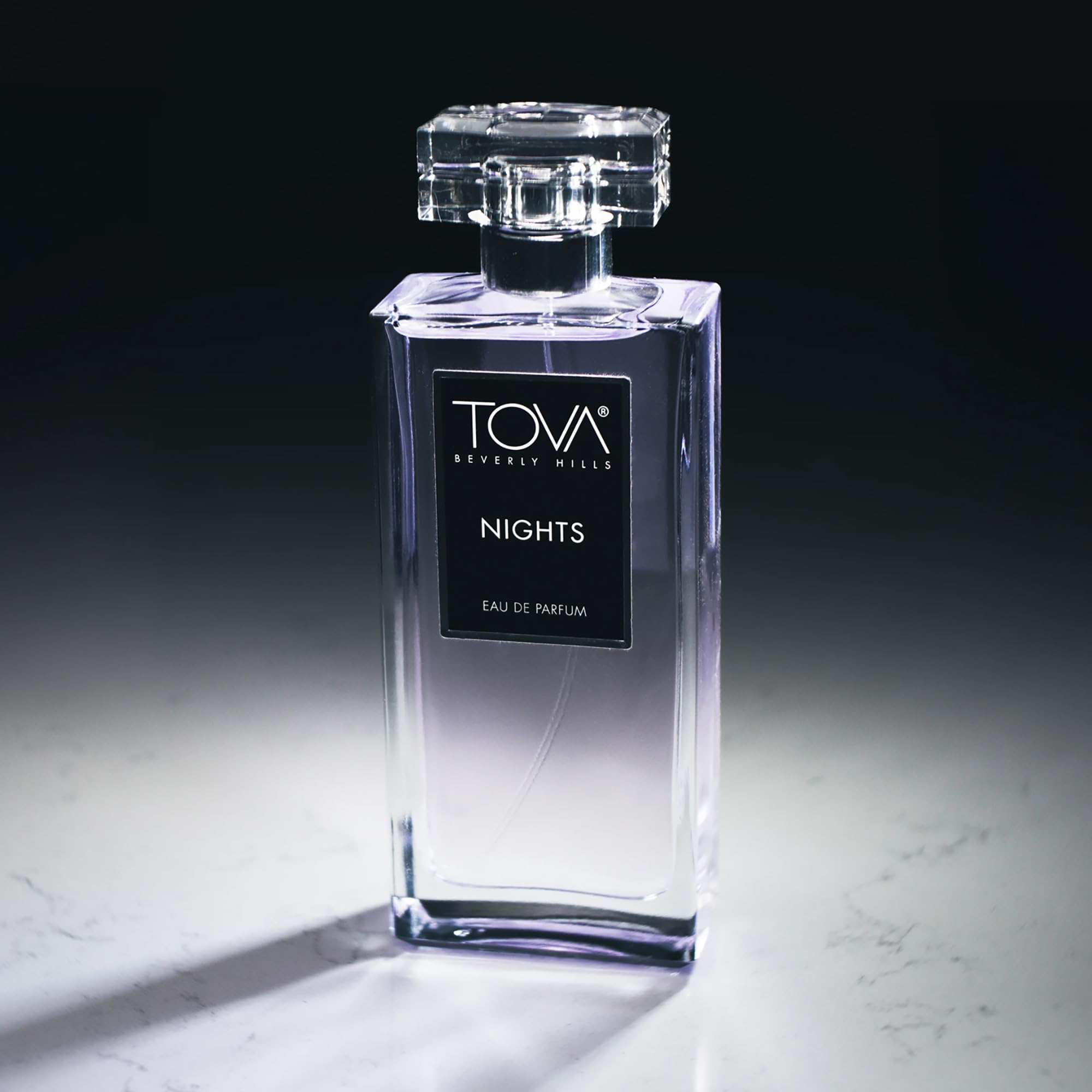 Tova Nights EDP bottle illuminated, evokes moonlit glamour for date nights.