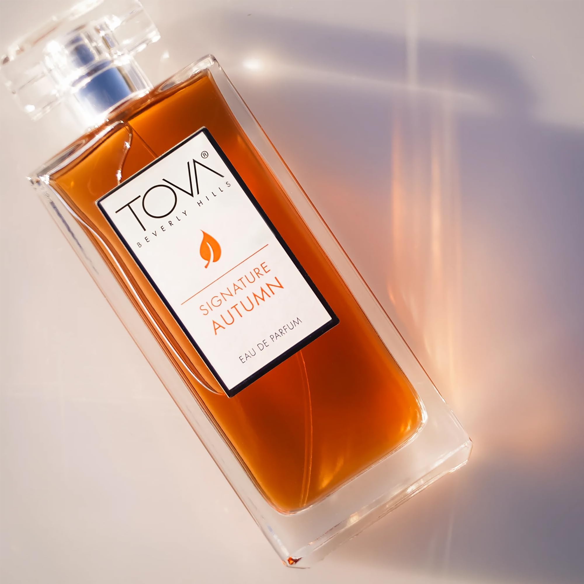 Tova Signature Autumn amber hue closeup, hints of vanilla orchid and sandalwood.