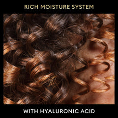 TRESemmé curly hair definition shot showcases frizz-free, defined curls.
