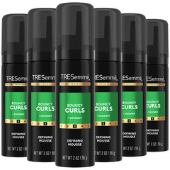 TRESemmé Defining Mousse bottle showing curl definition and lasting hold.