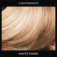 TRESemmé Dry Texture Finishing Mist bottle being spritzed into hair.