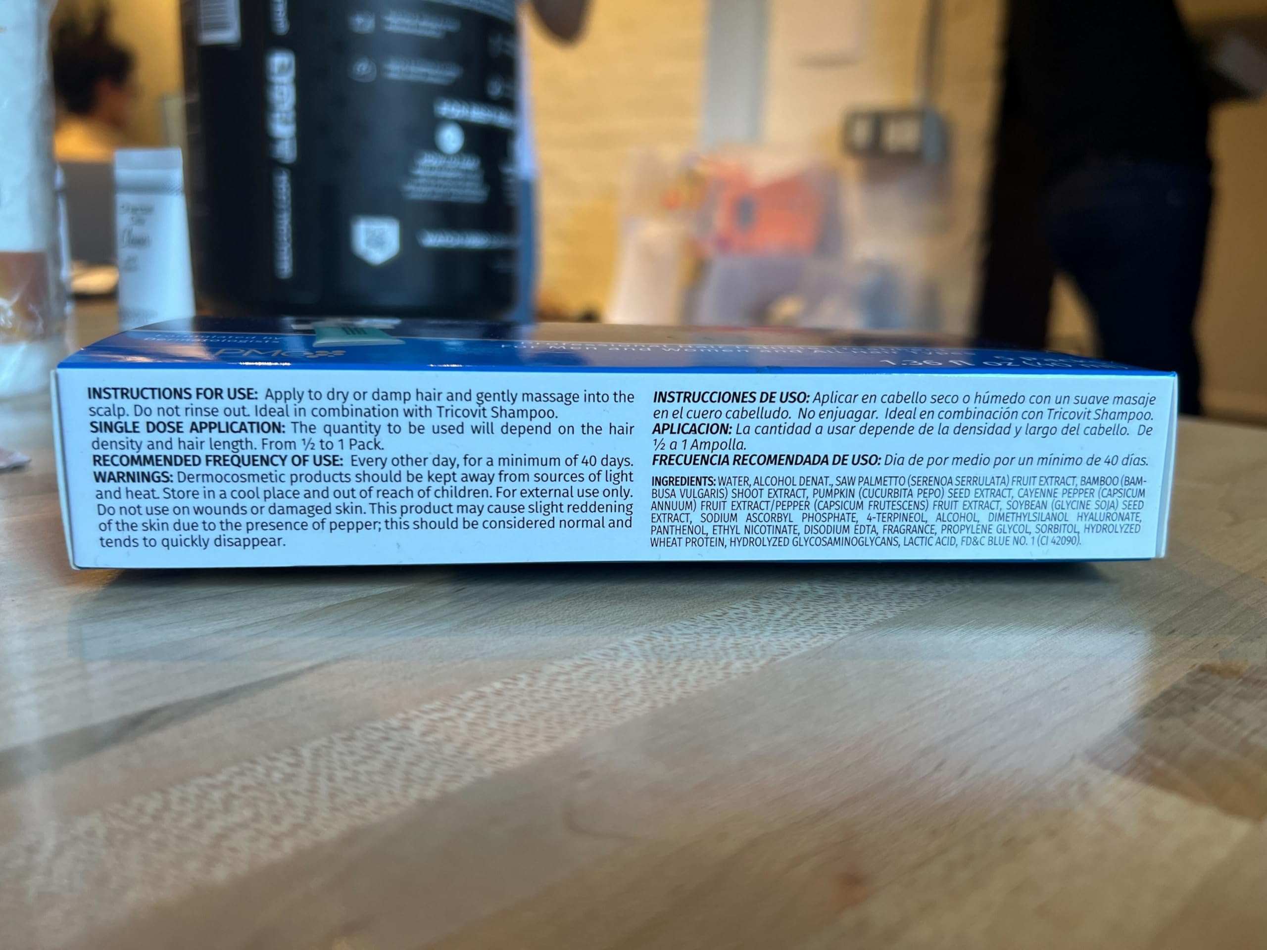 Unboxed Tricovit Forte packaging reveals compact ampoules.