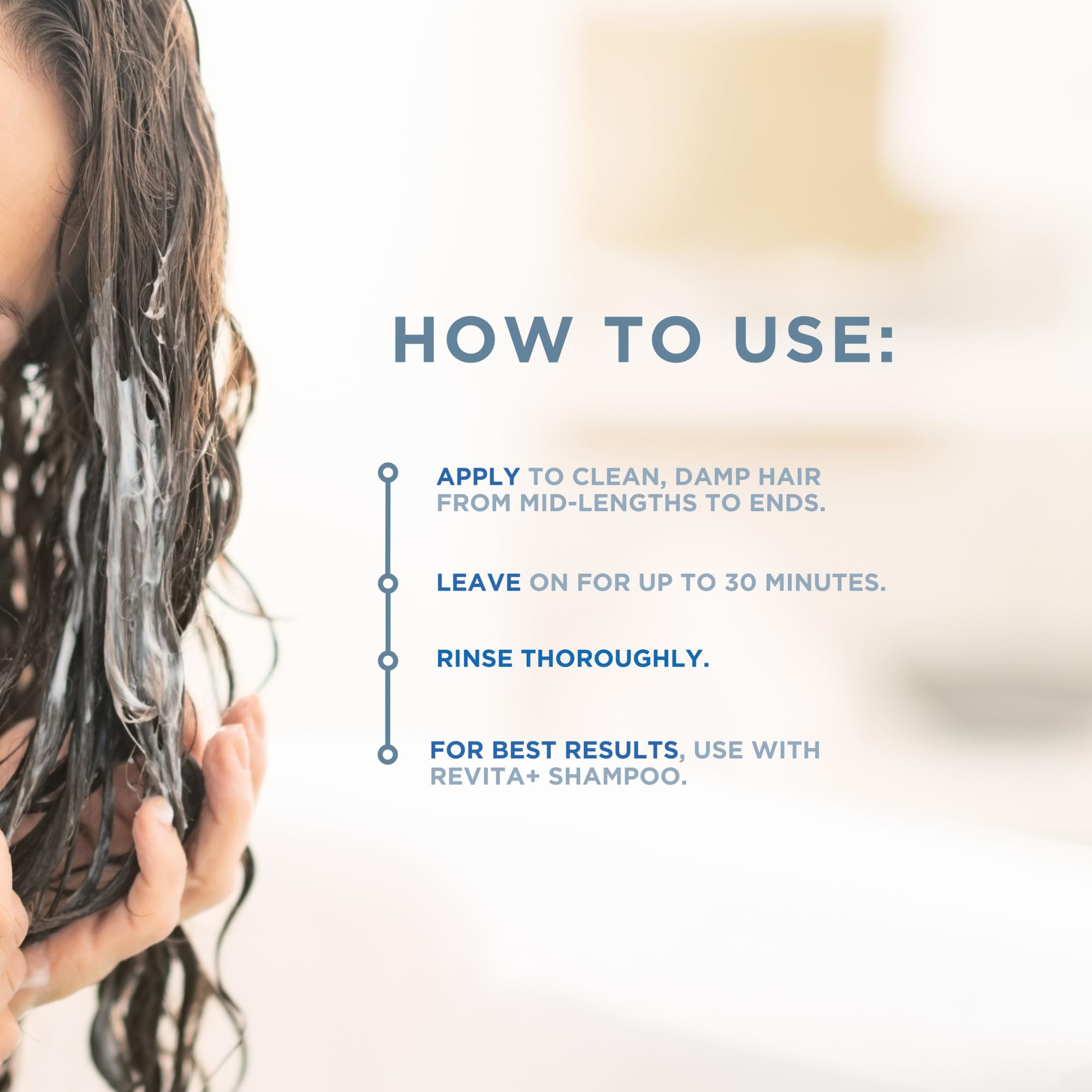 Hand applying Revita+ conditioner to damp hair for even coverage