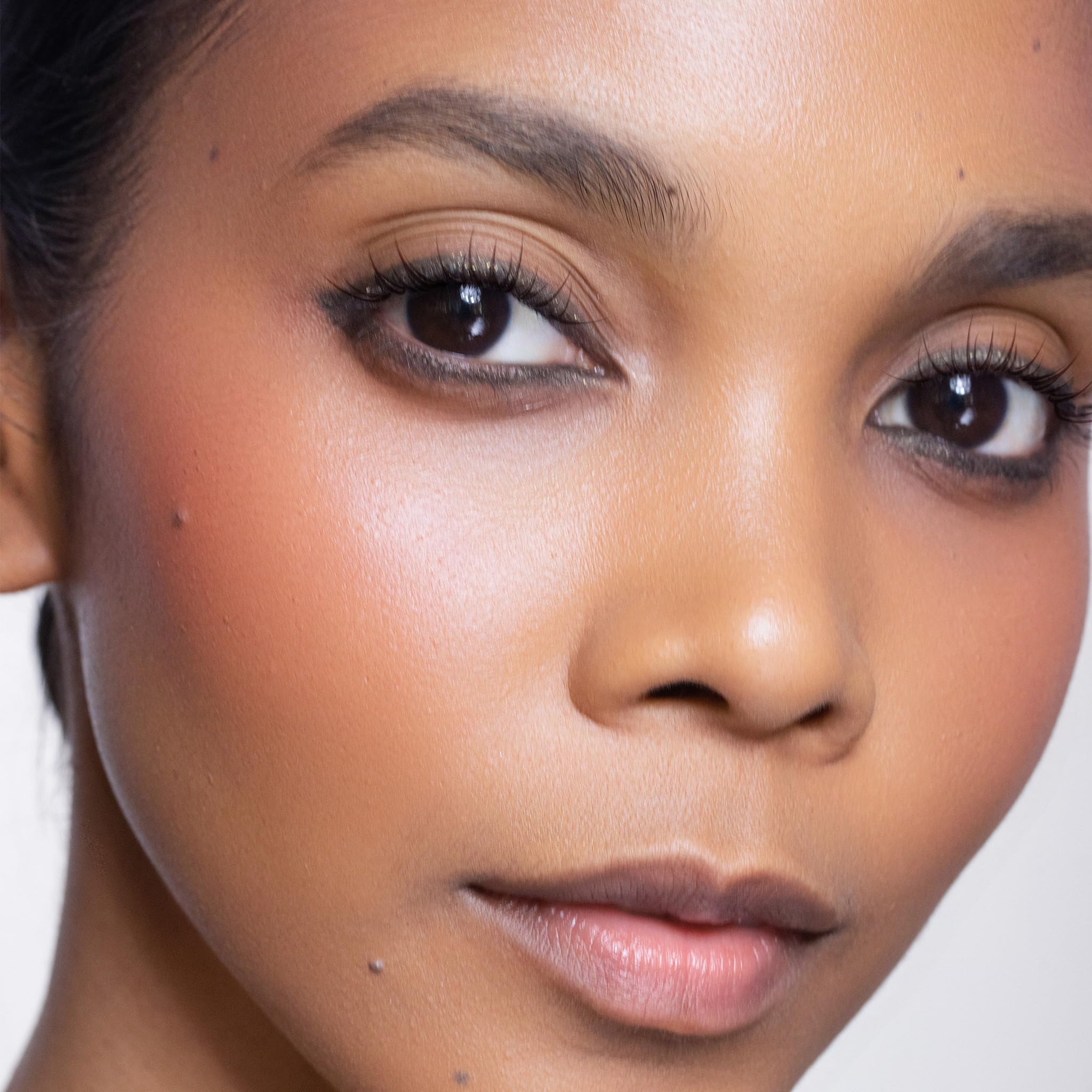 Trish McEvoy Liquid Face Color Pick Me Up on cheek glow for a natural, even finish.