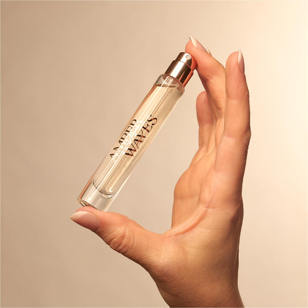 Amber Waves being spritzed on pulse points for lasting aroma
