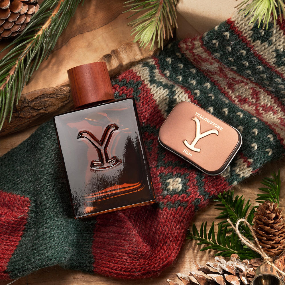 Tru Fragrance Beauty Yellowstone Ride bottle pour close-up with rich amber tones.