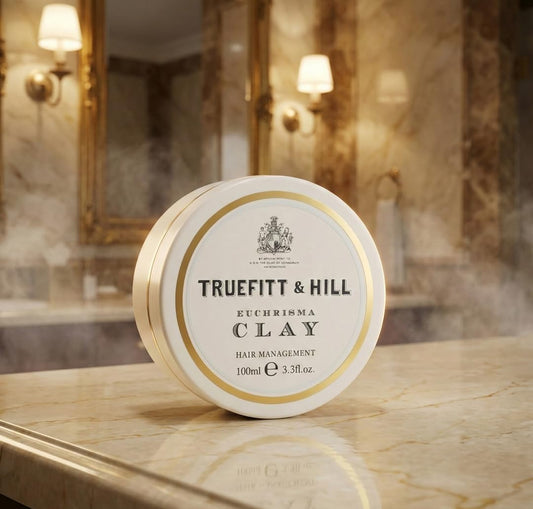 Close-up of Euchrisma Clay tin highlighting premium packaging and design.