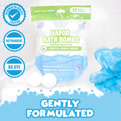 Tub Works Vapor Bath Bombs dissolving in tub water with rising vapors