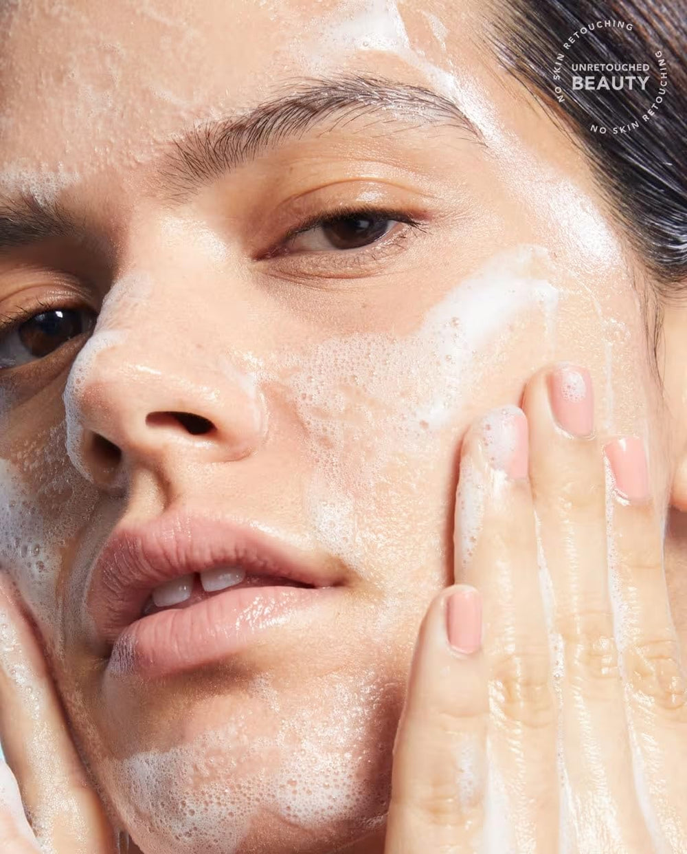 TULA face cleanser being massaged onto damp skin for cleansing.