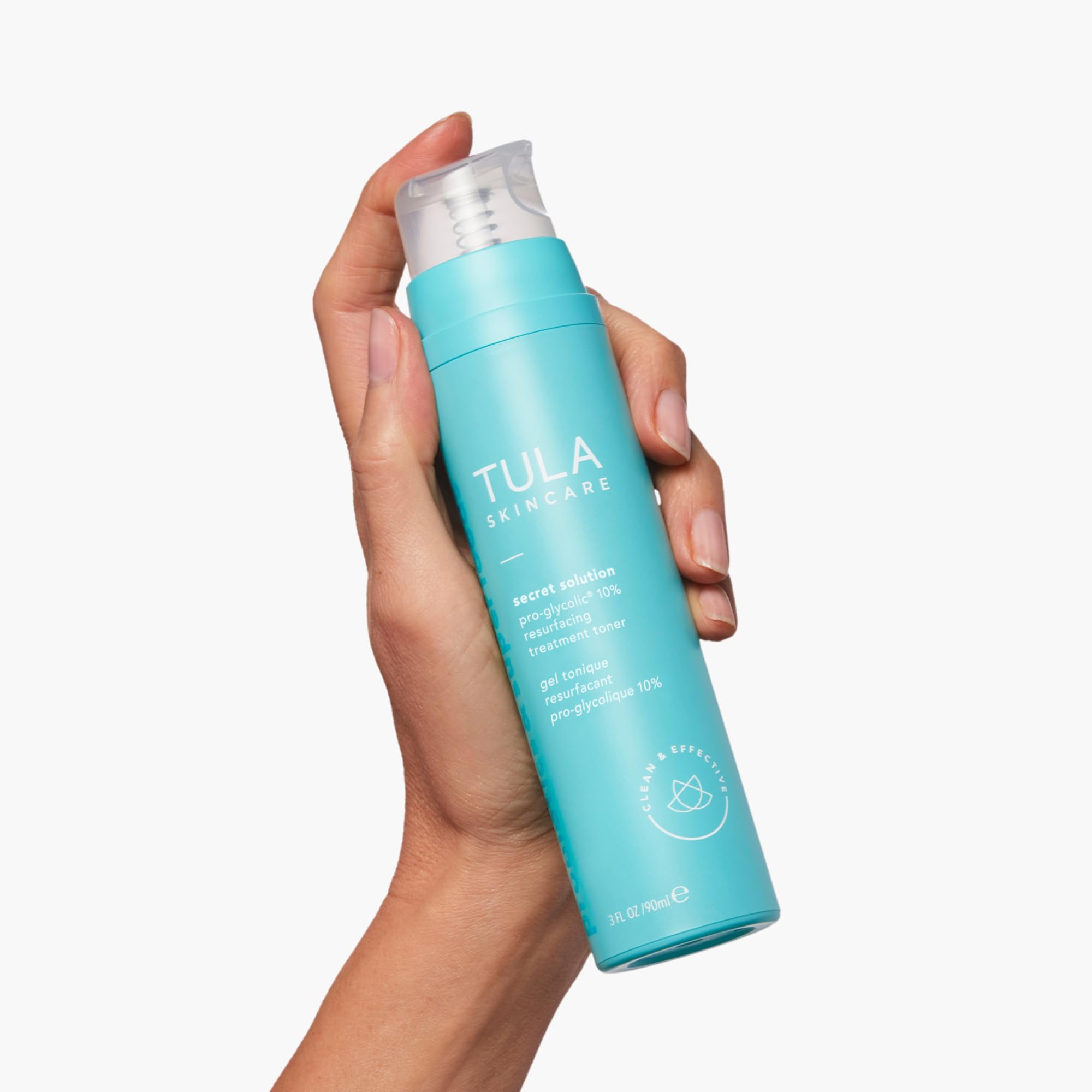 TULA Secret Solution Pro-Glycolic Toner being applied with a cotton pad for even tone