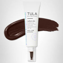 TULA skin tint on face proving dewy finish and even skin tone