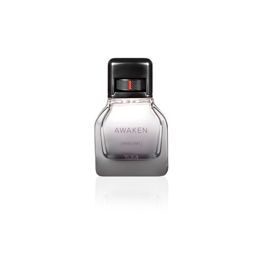 Close-up of TUMI AWAKEN bottle showing woody base notes.