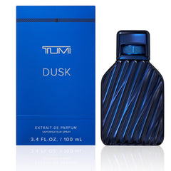 TUMI DUSK bottle close-up highlighting the woody aromatic profile for confident days.