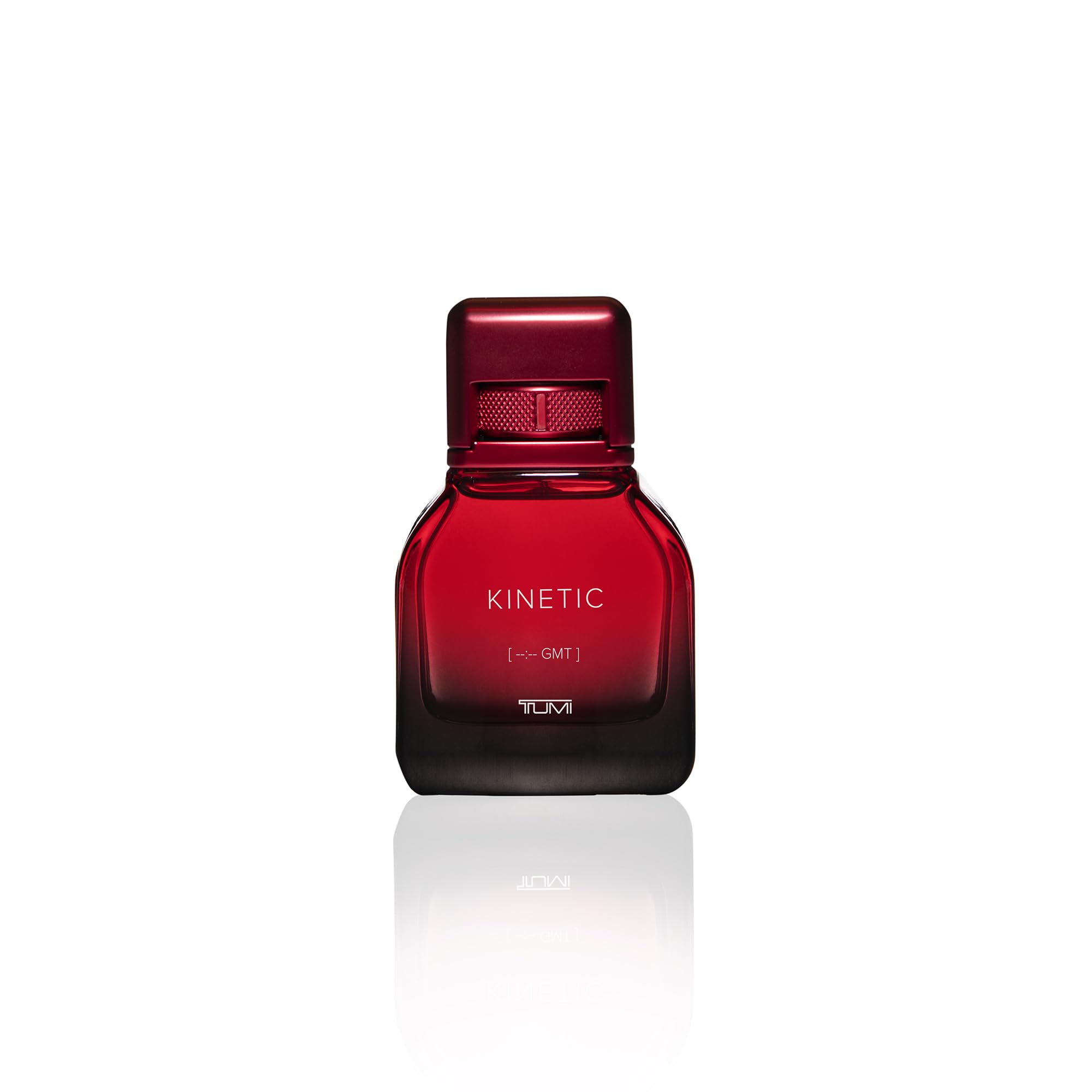 TUMI KINETIC amber-note close-up evokes warm, inviting first impression.