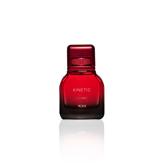 TUMI KINETIC amber-note close-up evokes warm, inviting first impression.