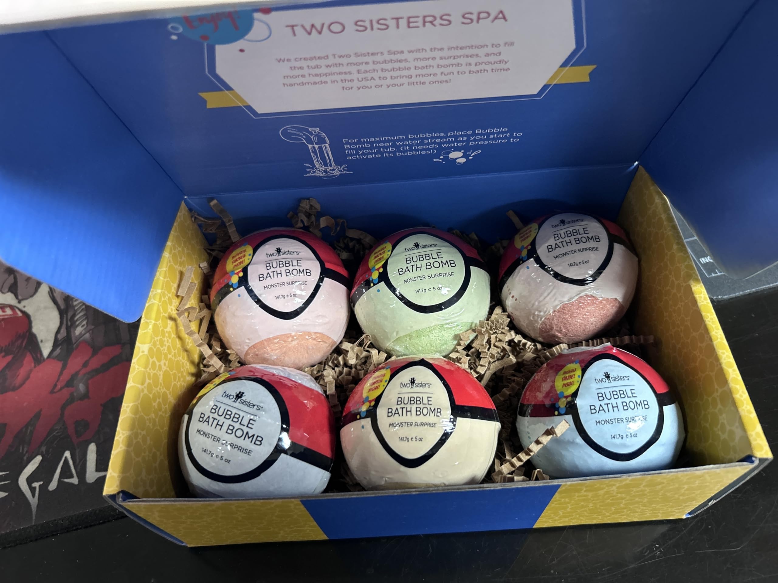 Two Sisters Poke Monster bath bomb creates vibrant colors and lasting bubbles for kids.
