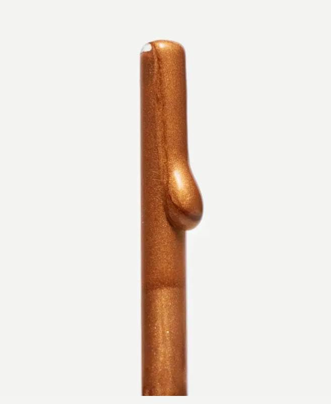 Typology Bronzing Drops applied to face and neck for customizable sun-kissed radiance