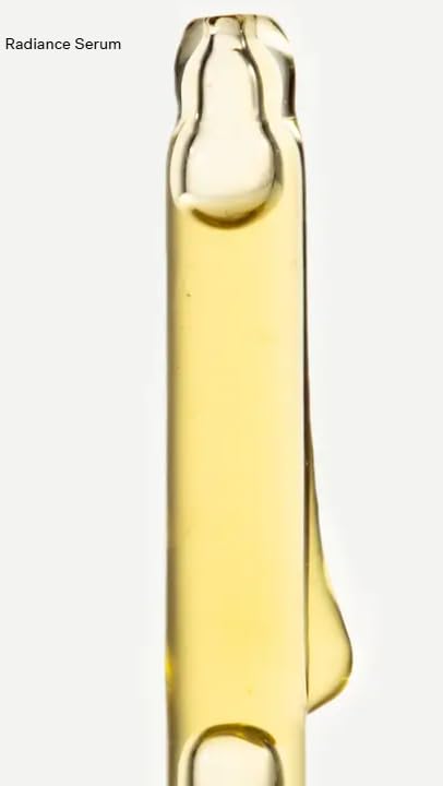 Typology Radiance Serum applied to the face before moisturizer for glow.