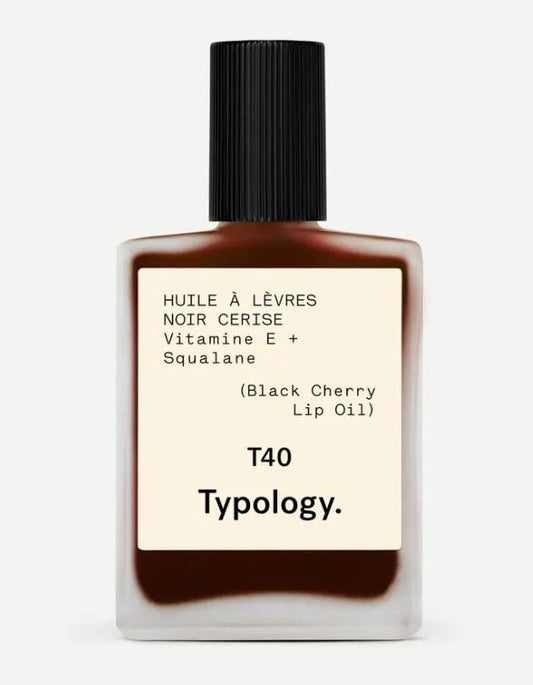 Typology tinted lip oil bottle with black cherry tint for nourished lips