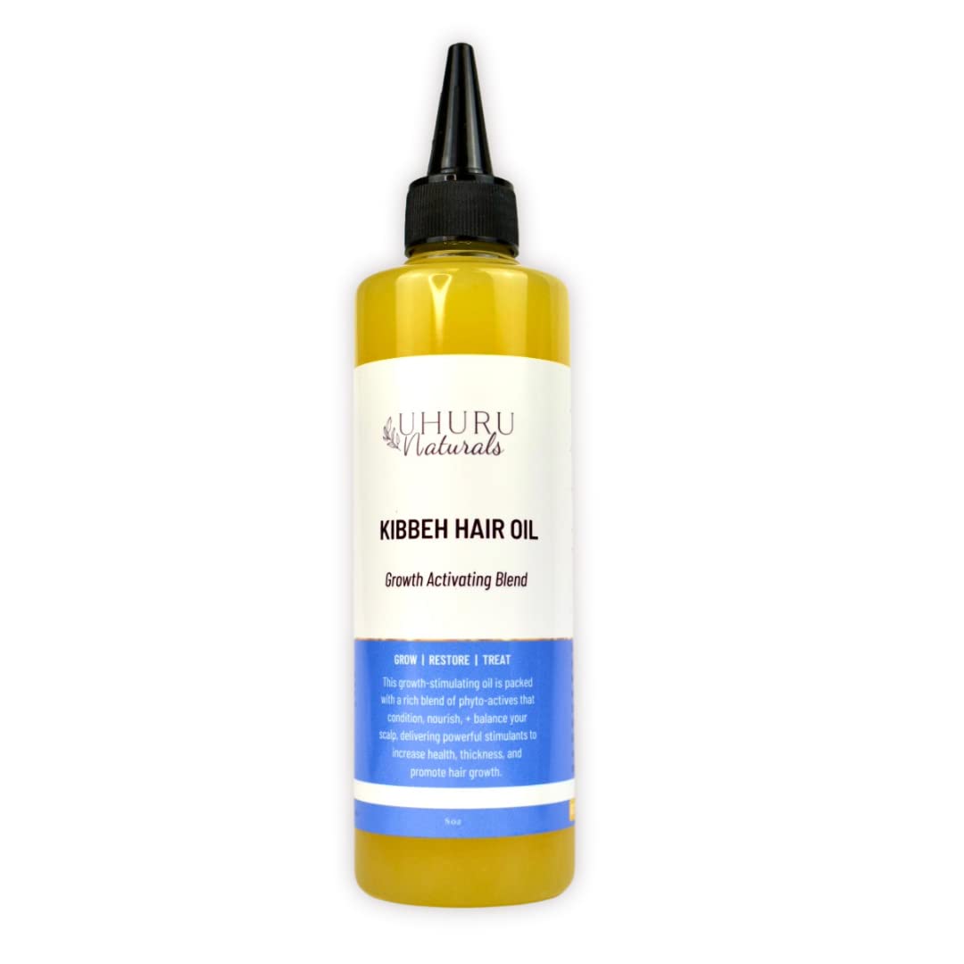 Uhuru Naturals Kibbeh Hair Growth Oil bottle pour; nourishes scalp and supports stronger, fuller hair.