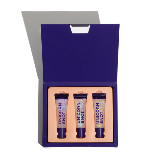 Unicorn Snot Glitter Boss lip gloss tube close-up emphasizing sparkly shine on lips.