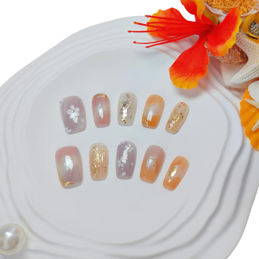 Uniyvoh cat eye nails with orange floral design for bold daily wear