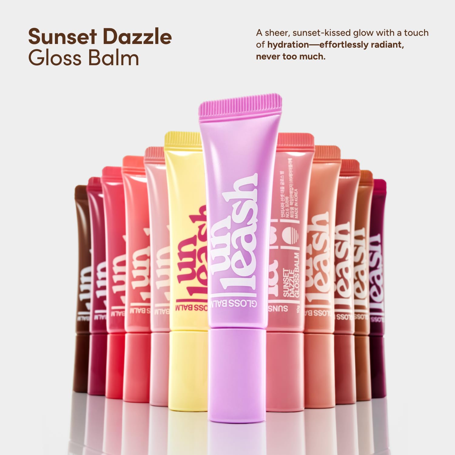 UNLEASHIA Sunset Dazzle Gloss Balm lip swatch with natural tint