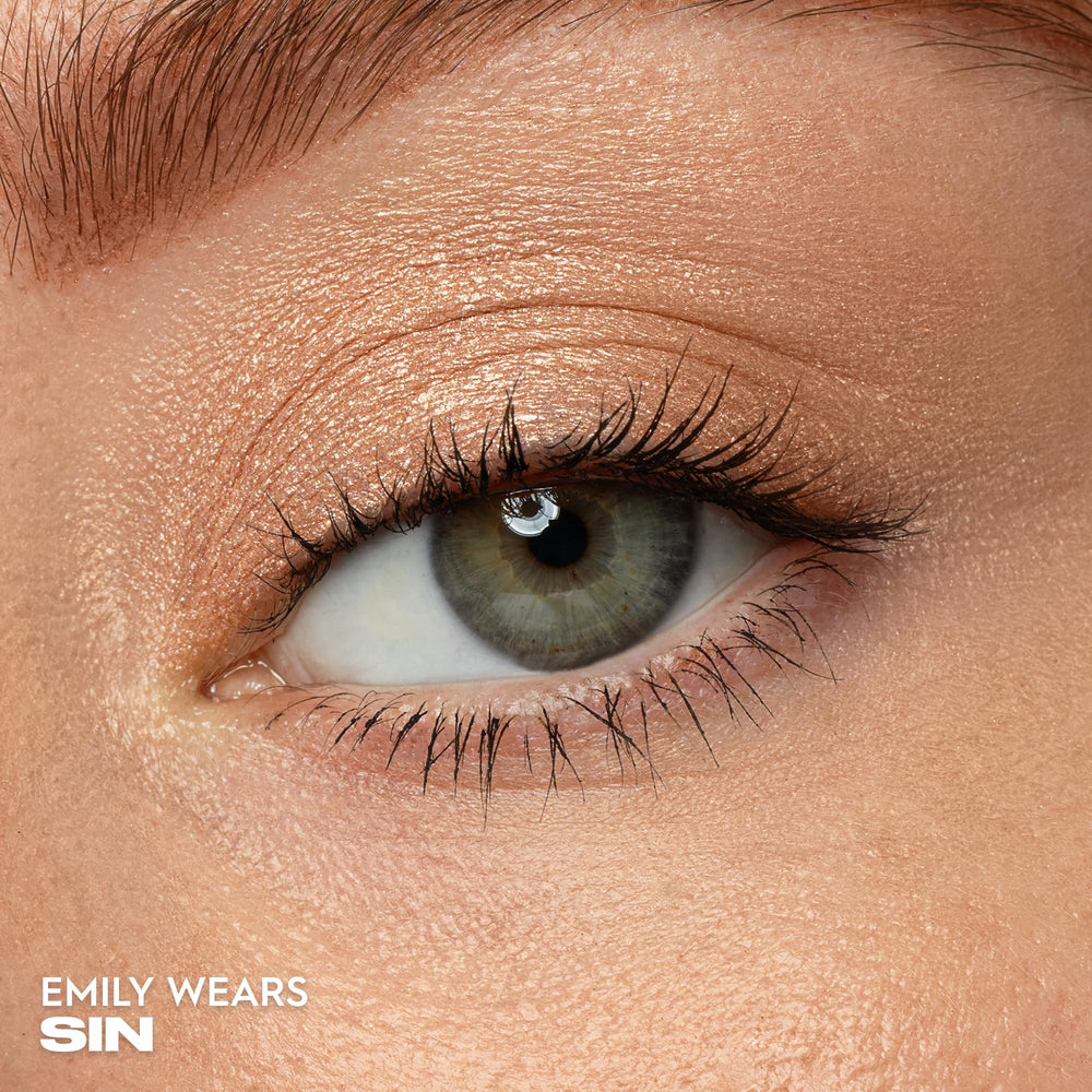 Urban Decay Sin close-up captures champagne shimmer and reflective micro-particles