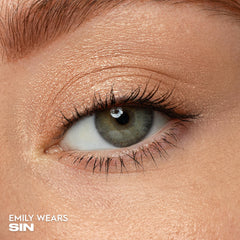 Urban Decay Sin close-up captures champagne shimmer and reflective micro-particles