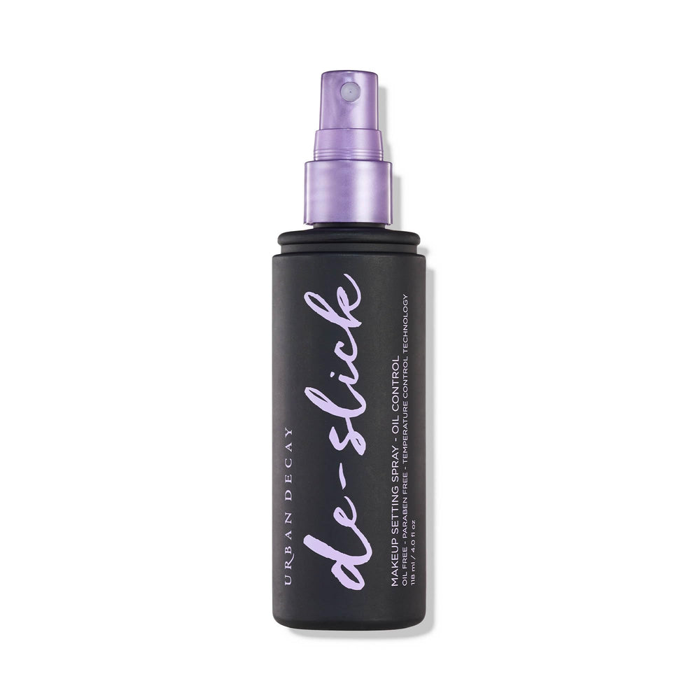 Urban Decay De-Slick bottle with matte spray for all-day oil control.