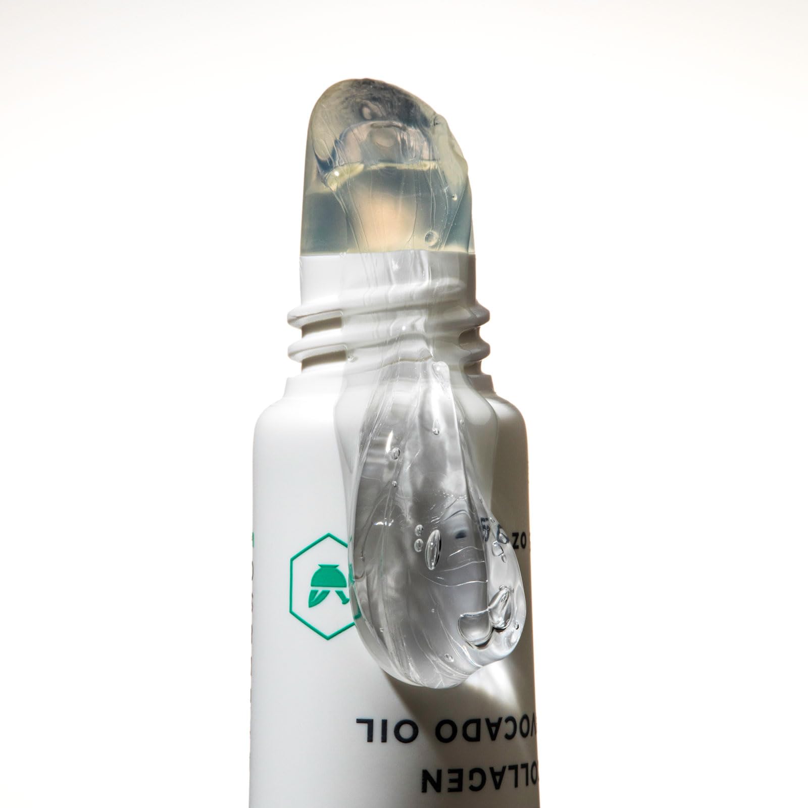 Close-up of clear balm being applied for a smooth base on lips