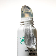 Close-up of clear balm being applied for a smooth base on lips