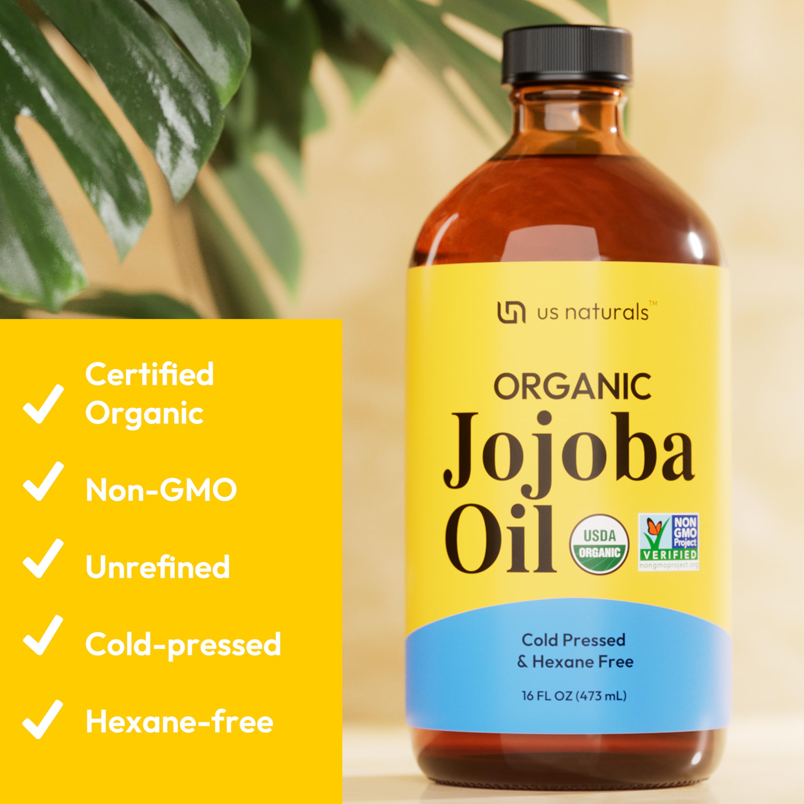 Dark amber bottle protects Us Naturals organic jojoba oil to maintain freshness