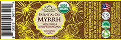 Close-up of US Organic Myrrh essential oil bottle label for clarity.