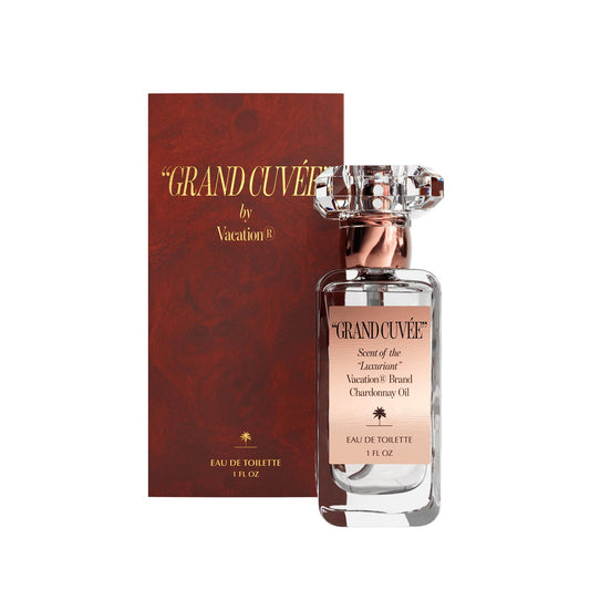 VACATION Grand Cuve9e bottle close-up showing vanilla amber notes for day-to-night wear.