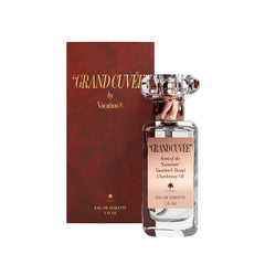 VACATION Grand Cuve9e bottle close-up showing vanilla amber notes for day-to-night wear.